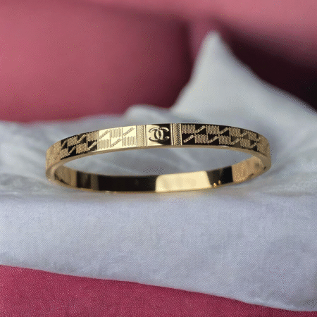 Gold Textured Geometric Bangle with Central Logo Emblem