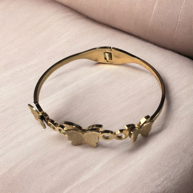 Golden Flutter Harmony Bangle with Textured Glitter Butterfly Motifs - Image 7