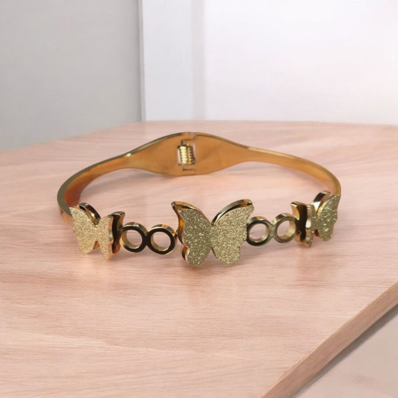 Golden Flutter Harmony Bangle with Textured Glitter Butterfly Motifs - Image 9