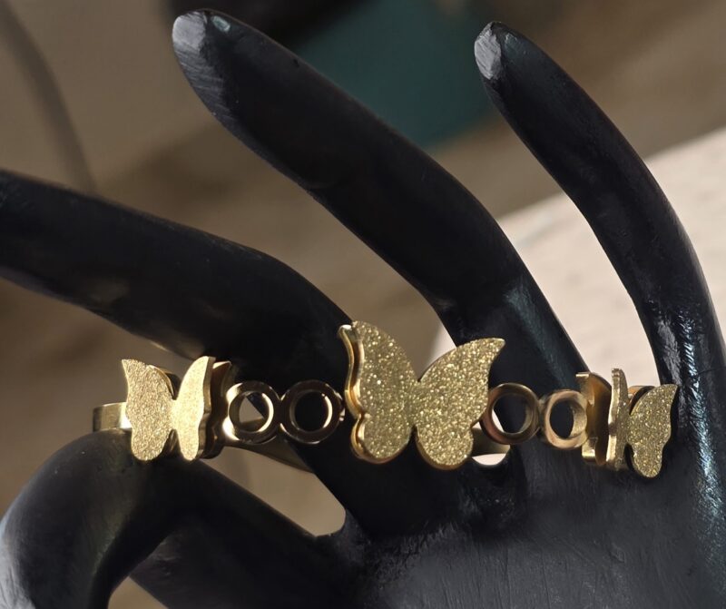 Golden Flutter Harmony Bangle with Textured Glitter Butterfly Motifs - Image 5