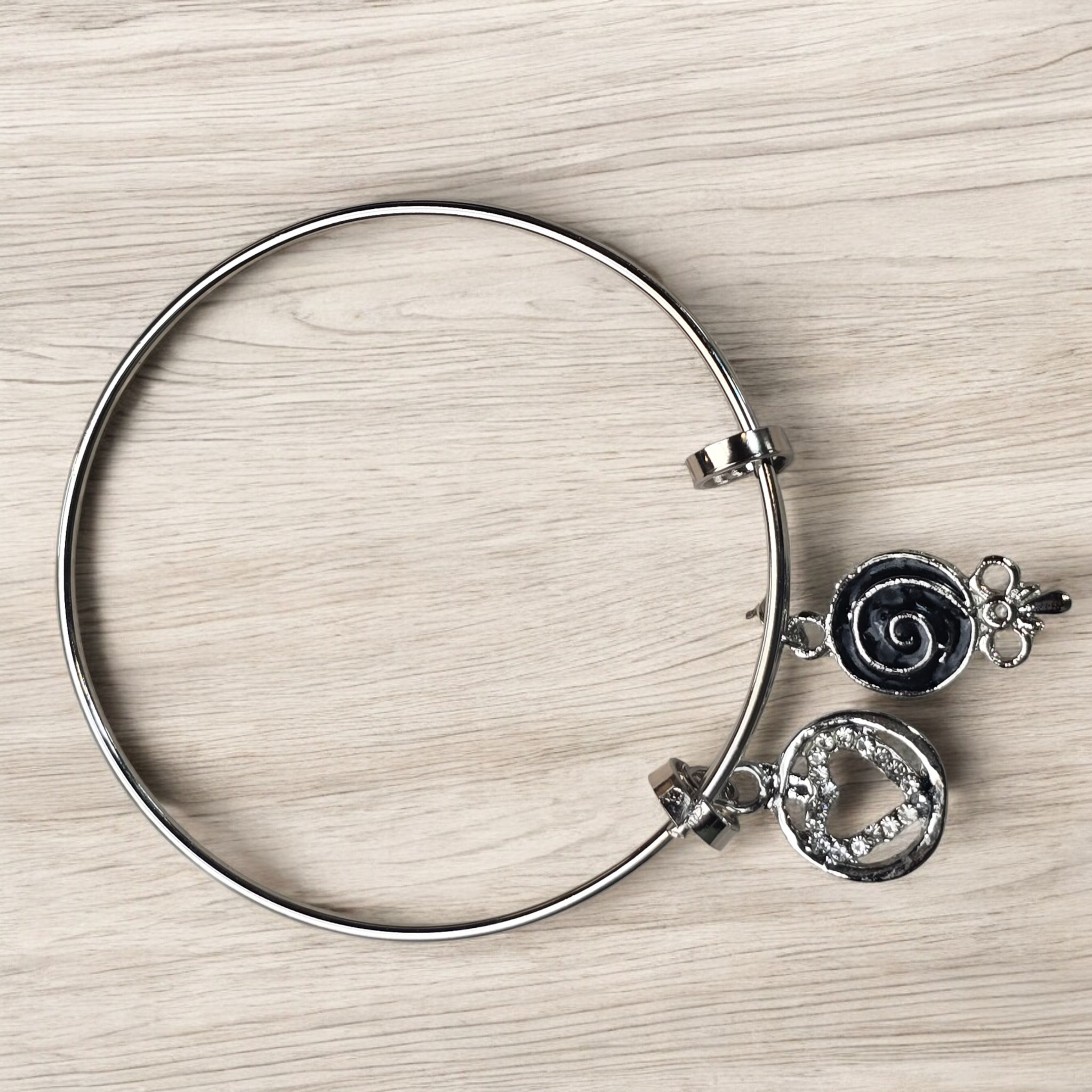 Silver Textured Bangle with Sculpted Heart and Swirl Charms - Image 4