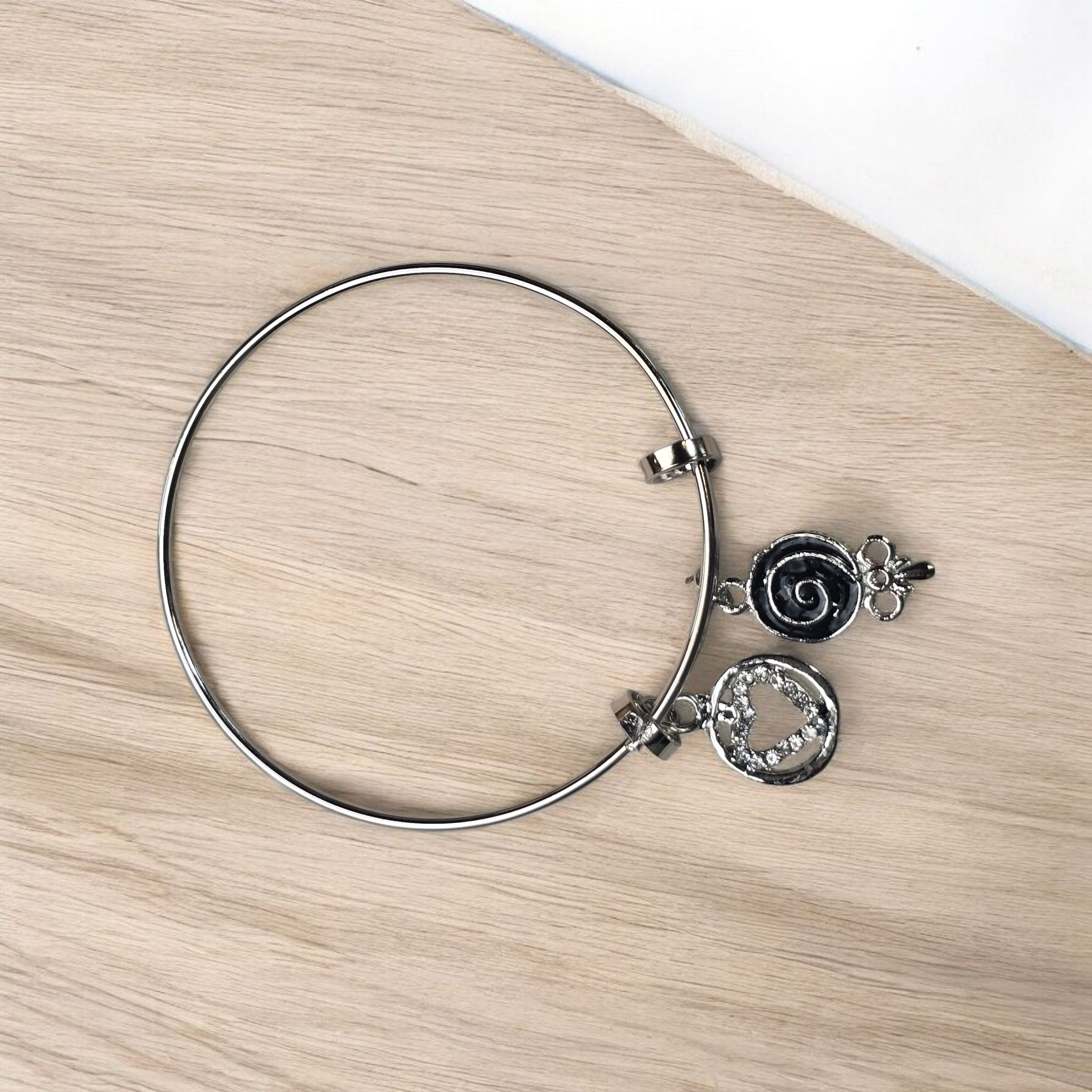 Silver Textured Bangle with Sculpted Heart and Swirl Charms - Image 2